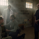 Siddiq (Avi Nash) treats the Whisperer prisoner while Dante (Juan Javier Cardenas) and Gabriel (Seth Gilliam) look on.